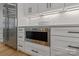 Modern kitchen featuring stainless steel appliances and white shaker cabinetry with marble backsplash at 3601 Woody Grove Ln, Charlotte, NC 28210