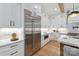 Modern kitchen with stainless steel appliances, custom cabinetry, and quartz countertops at 3601 Woody Grove Ln, Charlotte, NC 28210