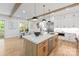Elegant kitchen featuring a spacious island, stainless steel appliances, and modern pendant lighting at 3601 Woody Grove Ln, Charlotte, NC 28210