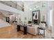 Elegant living room with soaring ceilings, a cozy fireplace, and an open floor plan at 3601 Woody Grove Ln, Charlotte, NC 28210