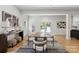 Open living room featuring a dining area with a modern rug and french doors to the yard at 3601 Woody Grove Ln, Charlotte, NC 28210