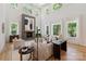 Bright living room with soaring ceilings, large windows, and a striking modern fireplace as its centerpiece at 3601 Woody Grove Ln, Charlotte, NC 28210
