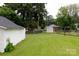 Beautiful backyard with a well-manicured lawn, a detached shed, and a sturdy chain-link fence, providing a secure outdoor space at 441 Jackson St, Rock Hill, SC 29730