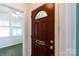 Elegant wood front door with decorative glass and brass hardware leading inside at 441 Jackson St, Rock Hill, SC 29730