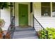 Charming green front door with decorative glass and wrought iron railings at 441 Jackson St, Rock Hill, SC 29730