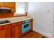 Cozy kitchen with wood cabinets, laminate countertops, and a bright blue oven at 441 Jackson St, Rock Hill, SC 29730