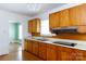 Traditional kitchen featuring wooden cabinets, laminate countertops, and a double basin sink at 441 Jackson St, Rock Hill, SC 29730