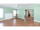 Bright living room with wood floors, fireplace, and open layout to kitchen at 441 Jackson St, Rock Hill, SC 29730