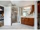 Bright bathroom featuring a glass shower, a double vanity, and white tile flooring at 4712 Amberside Dr, Rock Hill, SC 29732