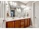 Elegant bathroom with double vanity, tile floor, and neutral color palette creates a serene retreat at 4712 Amberside Dr, Rock Hill, SC 29732
