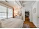 Bright bedroom features a large window, white dresser, and doorway leading to closet space at 4712 Amberside Dr, Rock Hill, SC 29732