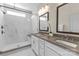 Bright bathroom showcases a marble tiled walk-in shower and double sink vanity with modern finishes at 5060 Harrowsmith Ln, Charlotte, NC 28204
