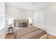 Comfortable bedroom featuring a bed with stylish bedding at 5060 Harrowsmith Ln, Charlotte, NC 28204