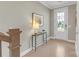 Bright entryway with hardwood floors, console table, and decor at 5060 Harrowsmith Ln, Charlotte, NC 28204