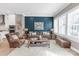 Warm living room featuring leather furniture, an area rug, and ample natural light at 5060 Harrowsmith Ln, Charlotte, NC 28204