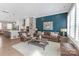 Open-concept living room featuring a modern fireplace and large windows at 5060 Harrowsmith Ln, Charlotte, NC 28204