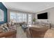 Bright living room with large windows, hardwood floors and entertainment center at 5060 Harrowsmith Ln, Charlotte, NC 28204