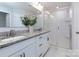 Bathroom featuring double vanity sinks, granite countertops, and a glass door shower at 512 Morrows Turnout Way, Pineville, NC 28134