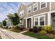 Attractive townhome exterior with lush landscaping and a welcoming sidewalk at 512 Morrows Turnout Way, Pineville, NC 28134