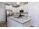 Beautiful kitchen with stainless steel appliances, granite countertops, and white cabinetry at 512 Morrows Turnout Way, Pineville, NC 28134