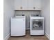Bright laundry room with modern, front-load washer and dryer and ample storage at 512 Morrows Turnout Way, Pineville, NC 28134