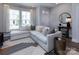 Cozy living room with a comfortable sectional sofa and bright, natural light at 512 Morrows Turnout Way, Pineville, NC 28134