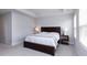 A spacious main bedroom featuring a large window, tray ceiling and carpeted floor at 512 Morrows Turnout Way, Pineville, NC 28134