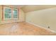 Attic room featuring a dormer and two windows with natural light at 520 Eastwood Park Cir, Albemarle, NC 28001
