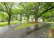 Circular driveway leading to a home surrounded by lush trees and landscaping, offering a grand entrance at 520 Eastwood Park Cir, Albemarle, NC 28001