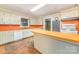 Spacious kitchen with orange countertops and vintage cabinets at 520 Eastwood Park Cir, Albemarle, NC 28001