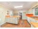 Spacious kitchen with orange countertops and vintage cabinets at 520 Eastwood Park Cir, Albemarle, NC 28001