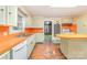 Spacious kitchen with orange countertops and vintage cabinets at 520 Eastwood Park Cir, Albemarle, NC 28001