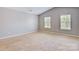 Spacious bedroom with large windows and plush carpeting at 5311 Oakdale Ridge Rd, Charlotte, NC 28216