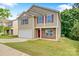 Charming two-story home with a well-maintained lawn, two car garage, and inviting curb appeal at 5311 Oakdale Ridge Rd, Charlotte, NC 28216