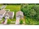 Aerial view of a well maintained home with a green lawn and a driveway at 5311 Oakdale Ridge Rd, Charlotte, NC 28216
