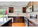 Kitchen featuring dark cabinets, granite countertops, stainless steel appliances at 5311 Oakdale Ridge Rd, Charlotte, NC 28216