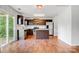 Modern kitchen features stainless steel appliances, central island and dark wood cabinets at 5311 Oakdale Ridge Rd, Charlotte, NC 28216