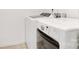This laundry room features a white washer and dryer at 5311 Oakdale Ridge Rd, Charlotte, NC 28216
