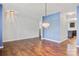 Spacious living room featuring new flooring, modern light fixtures, and plenty of space for entertaining at 5311 Oakdale Ridge Rd, Charlotte, NC 28216