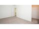 Bright bedroom with a closet and on-suite bath, with plush carpeting, and neutral paint at 617 English St, Monroe, NC 28110