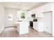 Modern kitchen with white cabinetry, stainless steel appliances, and a stylish island at 617 English St, Monroe, NC 28110