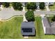 Aerial view of house featuring roof solar panels, green lawn and tree at 6229 Sid Crane Dr, Charlotte, NC 28216