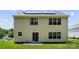 Home's backyard with siding, windows, door, patio, and lawn at 6229 Sid Crane Dr, Charlotte, NC 28216
