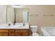 Bright bathroom features a double sink vanity, toilet, and partial view of the tub/shower at 6229 Sid Crane Dr, Charlotte, NC 28216