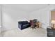 Bedroom features sitting area, desk space and neutral wall-to-wall carpeting at 6229 Sid Crane Dr, Charlotte, NC 28216