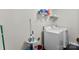 Practical laundry room equipped with a washer, dryer, and storage shelves at 6229 Sid Crane Dr, Charlotte, NC 28216