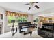 Bright living room with hardwood floors and a view into the kitchen at 6229 Sid Crane Dr, Charlotte, NC 28216
