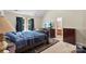 Vaulted main bedroom featuring a television, large windows, and access to an ensuite bathroom at 6229 Sid Crane Dr, Charlotte, NC 28216