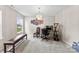 Bright room with a crystal chandelier and a desk setup at 6229 Sid Crane Dr, Charlotte, NC 28216