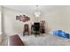 Well-lit room featuring a chandelier and neutral walls at 6229 Sid Crane Dr, Charlotte, NC 28216